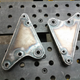 Freshly fabricated bellcranks which allowed the shocks and springs to sit sideways in the rear of the car.